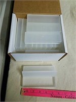 Box full of small plastic storage boxes
