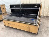 Hussmann refrigerated open case on casters