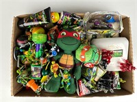Flat box of TMNT items figures and such