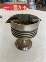 Piston ashtray