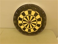 Dart board with darts