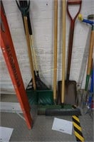 assorted yard tools-rakes, shovels, claw, grass