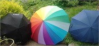 Three Umbrellas Of Various Sizes