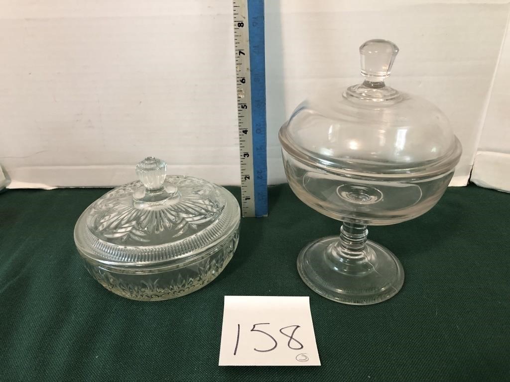 2 covered glass dishes