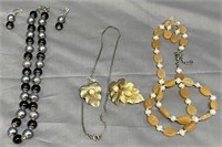 Three vintage necklace and earring sets