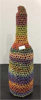 Colorful unusual wine bottle cover made of inner