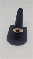 Gold tone with red stone ring marked www sz  8.5