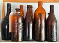 Lot #4340 - (9) amber bottles and druggist
