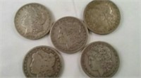 5 silver dollars dated 1878, 1879, 1891, 1897 and