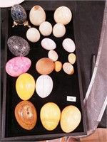 Four eggs, mostly alabaster from 1" to 2 3/4"