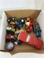 Box of Plastic Monster Trucks, Figures and More
