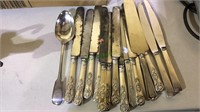 Group 14 table knives, silver plate handles, pie