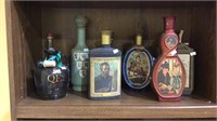 9 collector whiskey bottles , beams choice,