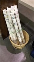 Bushel basket with 9 double rolls of wall paper,