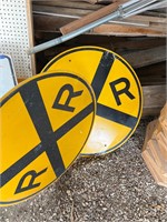 Two railroad crossing signs