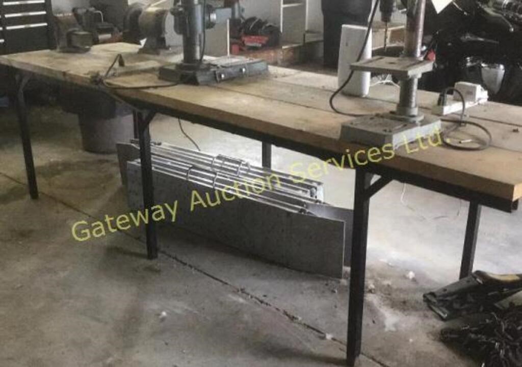 Table with vise. 28 wide, 103 inch long 28 high.