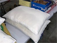 two clean bed pillows