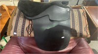 Black leather horse saddle by Victory with a