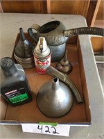 Box of funnels and oil