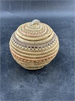 Coiled Hooper Bay lidded grass basket with sealski
