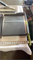 Paper cutter, clipboard with calculator, paper