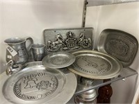 Pewter plates, cups, license plate, tray.
