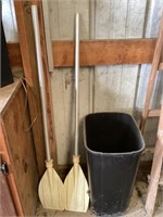 Paddles and garbage can