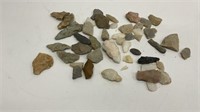 Box of Indian arrowheads and other stone tools