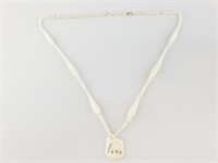 Bone beaded necklace with elephant center piece