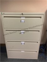 One four drawer, large personnel, filing cabinet