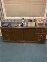 A very nice 4 drawer, two door wood cabinet glass