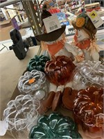 2 scarecrows and 7 plastic pumpkin containers