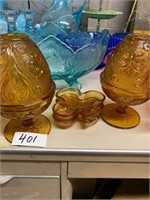 PAIR OF AMBER GLASS COVERED CANDY DISHES