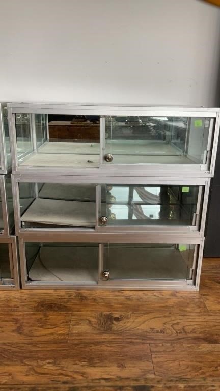 Three locking display cases with mirrored backs