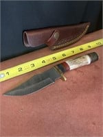 Damascus steel 8 inch knife with leather sheath.