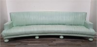 Custom curved leather-upholstered sofa