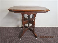Victorian walnut parlor table, gingerbread carving