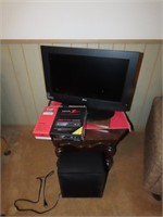 LG Tv flat screen w/stand & contents.