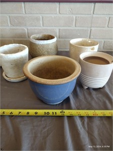Multiple clay flower pots, various sizes