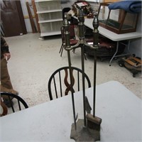 Cast metal fireplace tools.