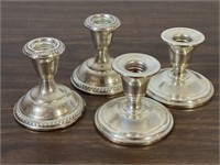 Four Weighted Sterling Candlesticks