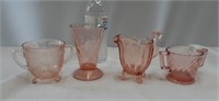 Pink depression glass, one of the sugar Bowls has