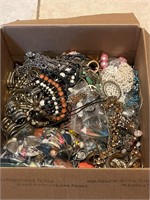 Box of costume jewelry for crafting and repair