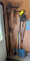 Group of garden tools: spade, rakes,etc.