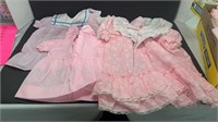 Box of girls baby clothes, approximately size