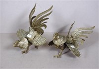 Two metal fighting roosters