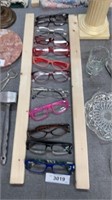 12 pairs of reading glasses