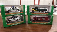 4 MINIATURE HESS TRUCKS DIE CASTS NIB