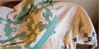 Two old hand-sewn cutter quilts