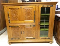 Continental Rosette Carved Oak Bar Cabinet.